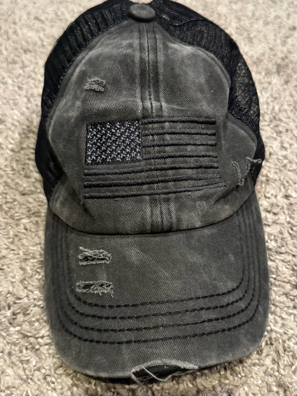 Distressed Womenโs Trucker Cap with Embroidered Flag